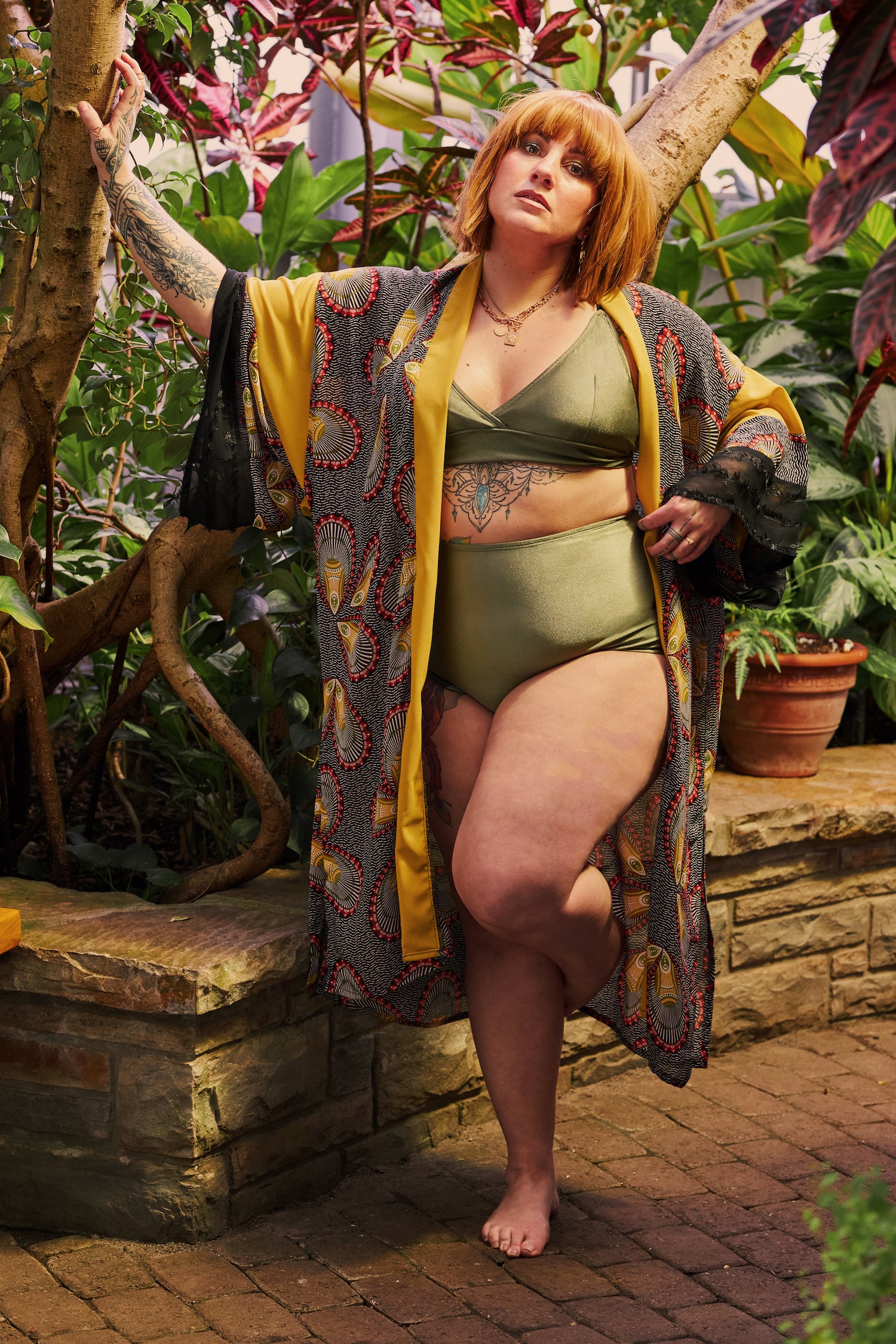 women wearing high waisted bikini bottom with adjustable top in a shinny khaki colour with kimono cover up