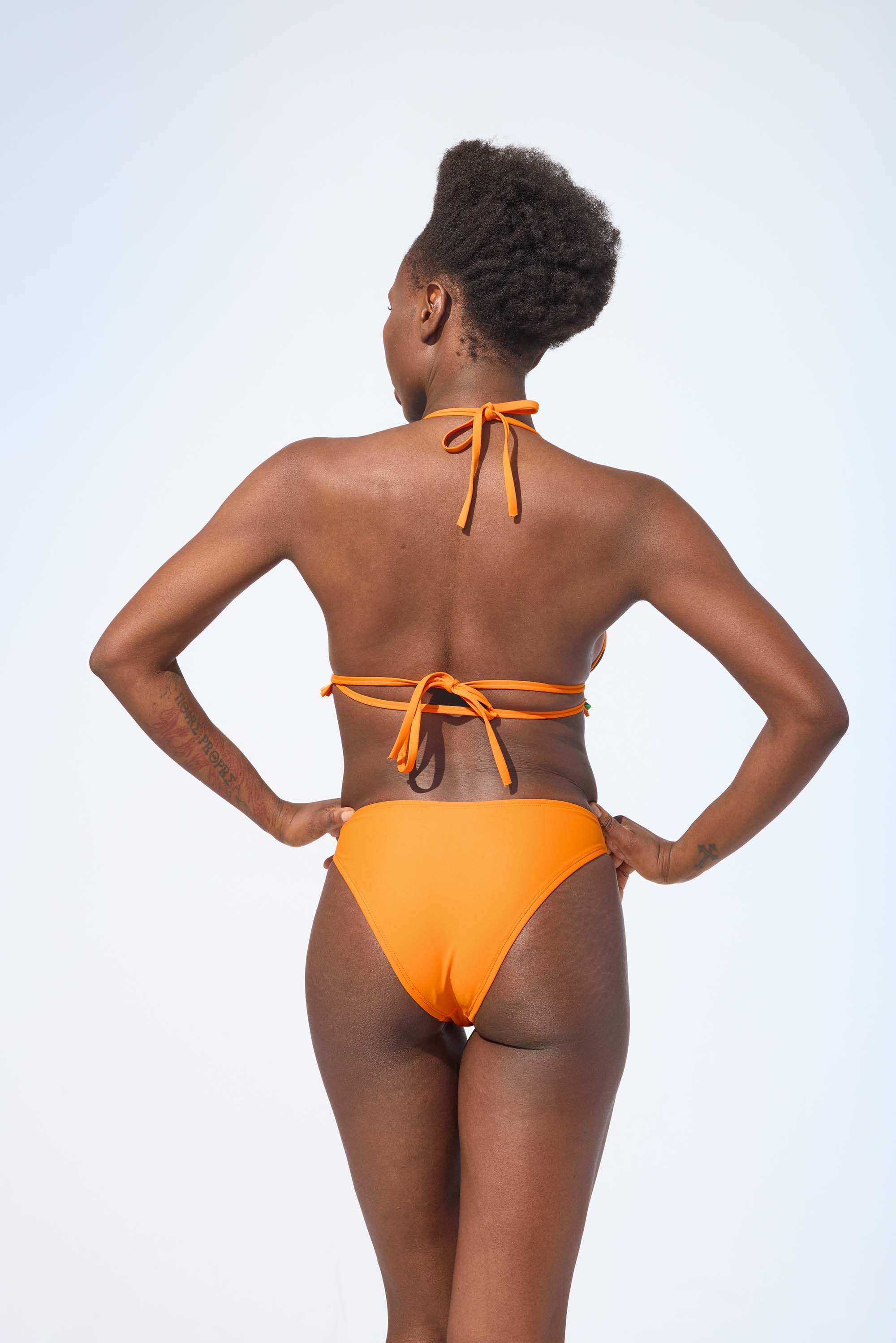 ROXY REVERSIBLE – Bikini top in Pumpkin orange & Essence print
