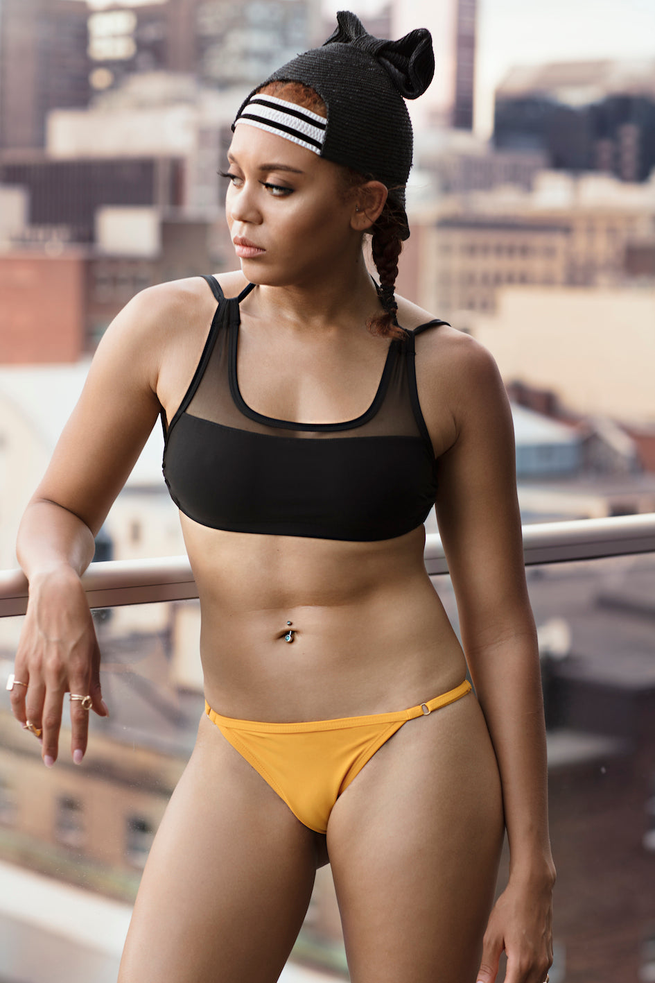 Black and mesh bikini top and yellow bottom